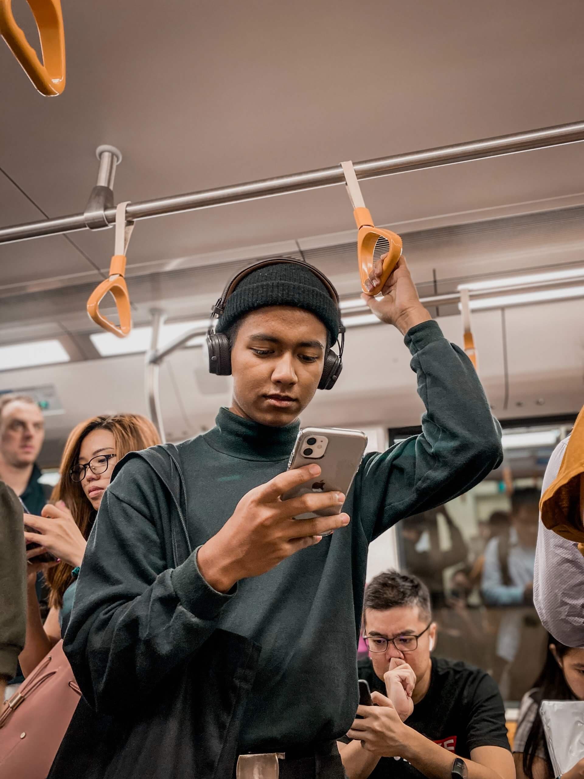 Male on a train using farmVest